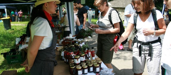 Farmer at a local market selling jams 